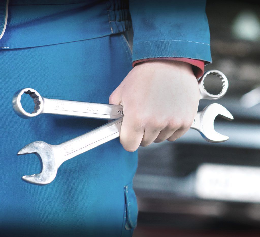 Mechanic holding a pair of spanners - Online MOT Booking